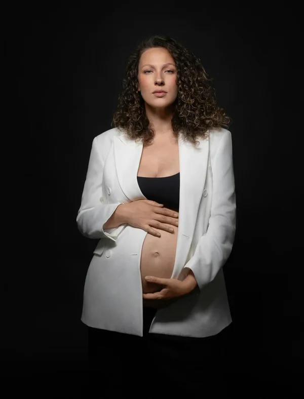 Maternity portrait in a white blazer after skin and colour retouching